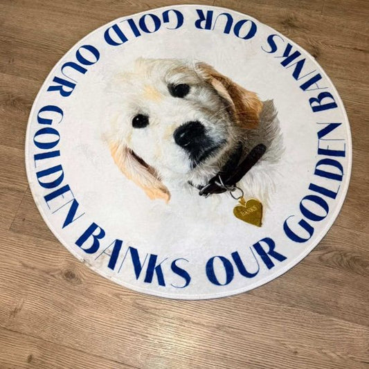Round custom portrait rug of golden retriever puppy Banks on a wood floor