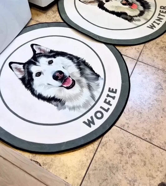 Two custom husky portrait rugs, Wolfie and Winter, on a tiled laundry room floor